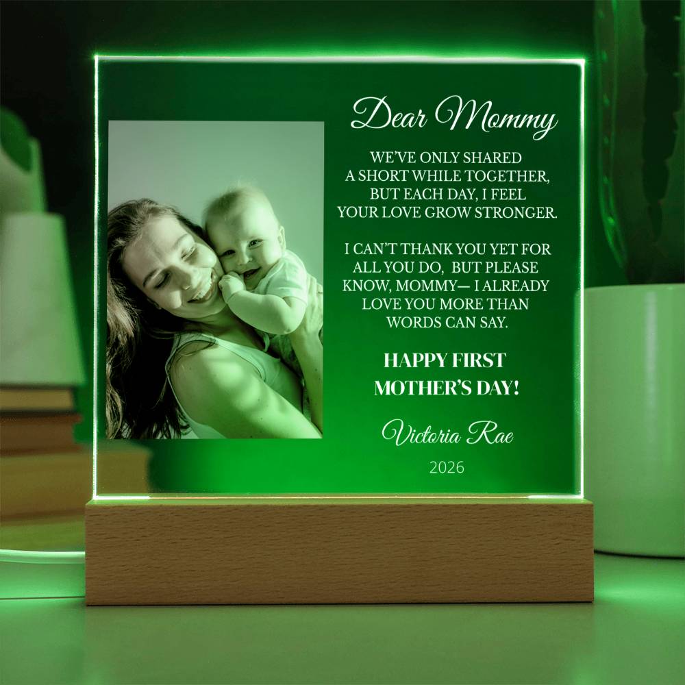 Personalized first Mother's Day gift with a photo of a woman holding a baby and engraved text.