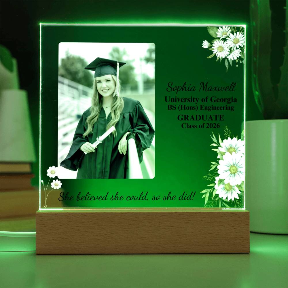 Graduation-themed decorative plaque with a photo of a graduate and text on a green background.