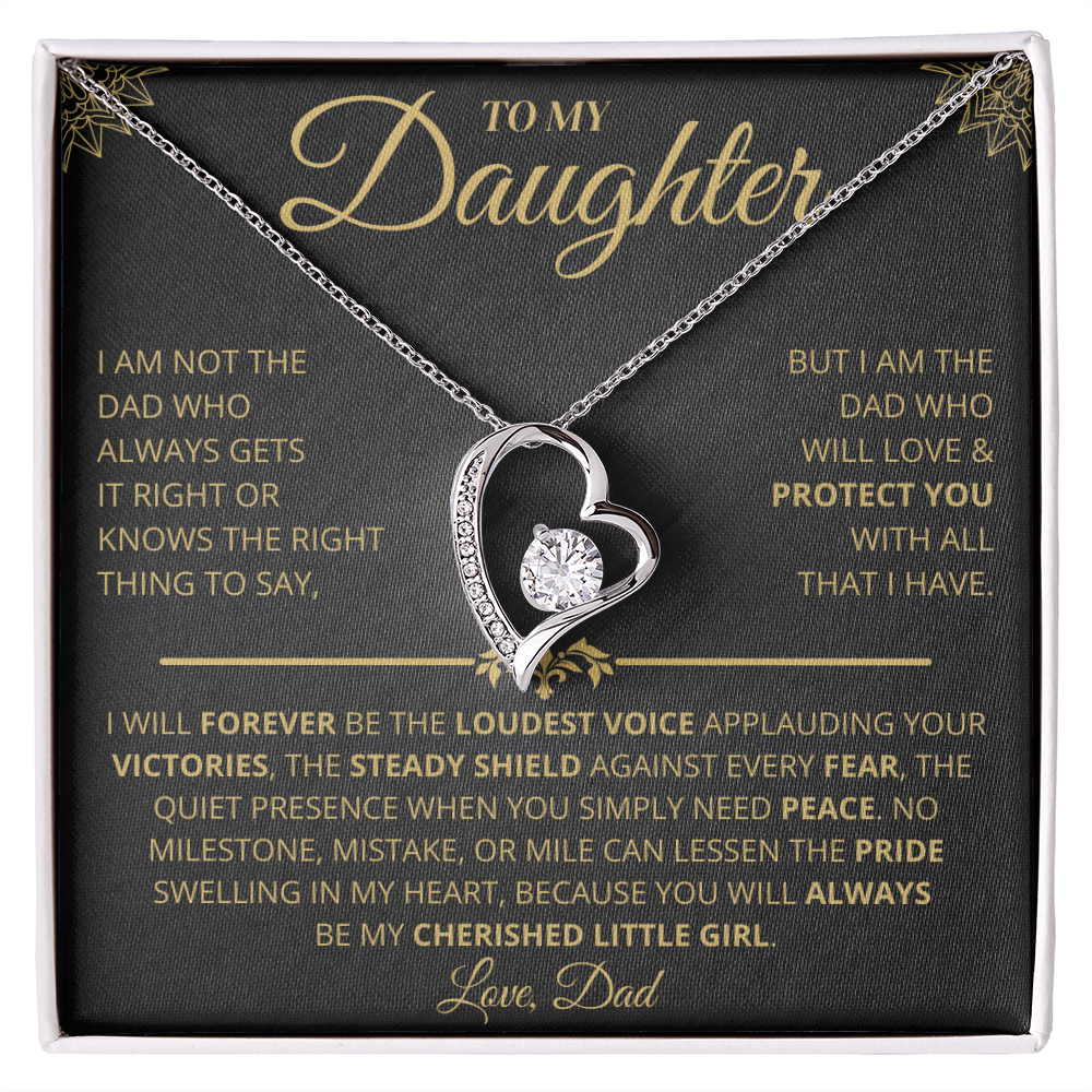 A necklace with a heart-shaped pendant containing a CZ crystal, given as a gift from dad to daughter, presented on a message card.