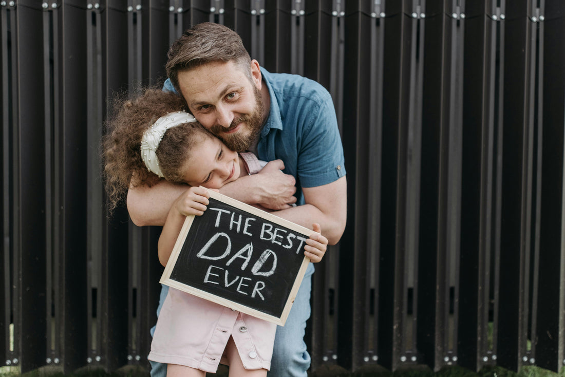 father hugging daughter