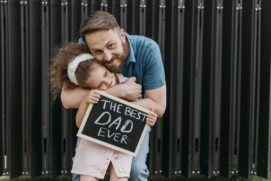 father hugging daughter