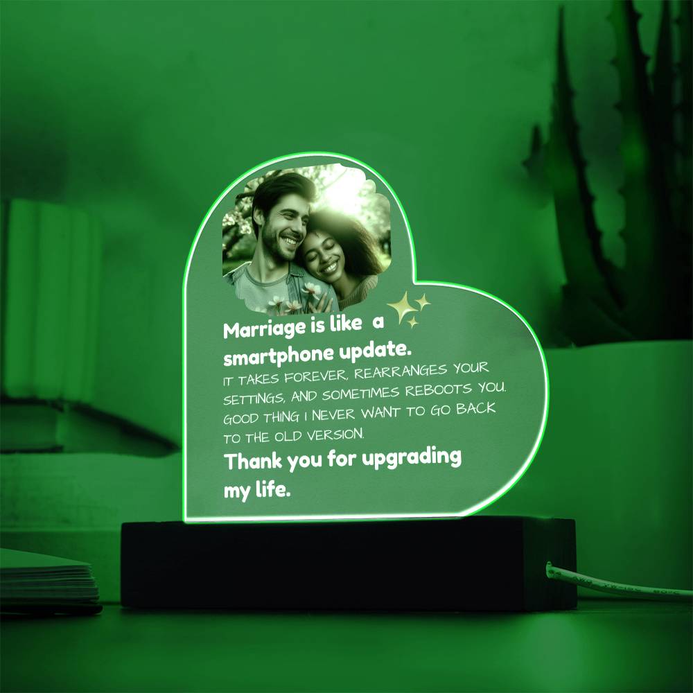 Heart-shaped LED lamp with a romantic quote and photo on a green background