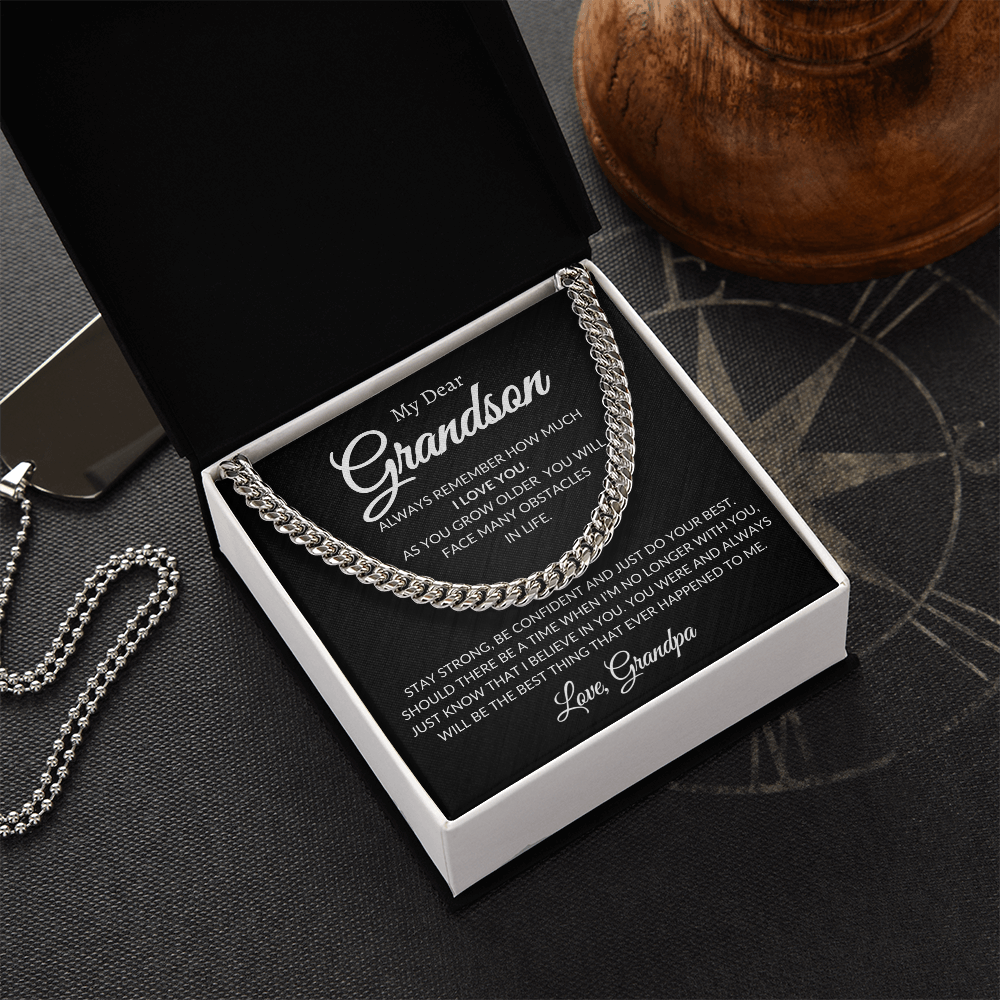 Close-up of Cuban Link Chain: adjustable link necklace in 14K yellow gold finish on a polished stainless-steel option.