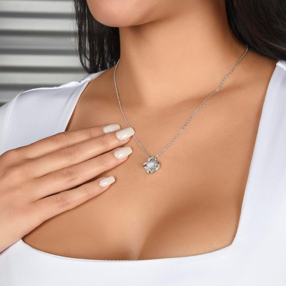 Model wearing love knot necklace