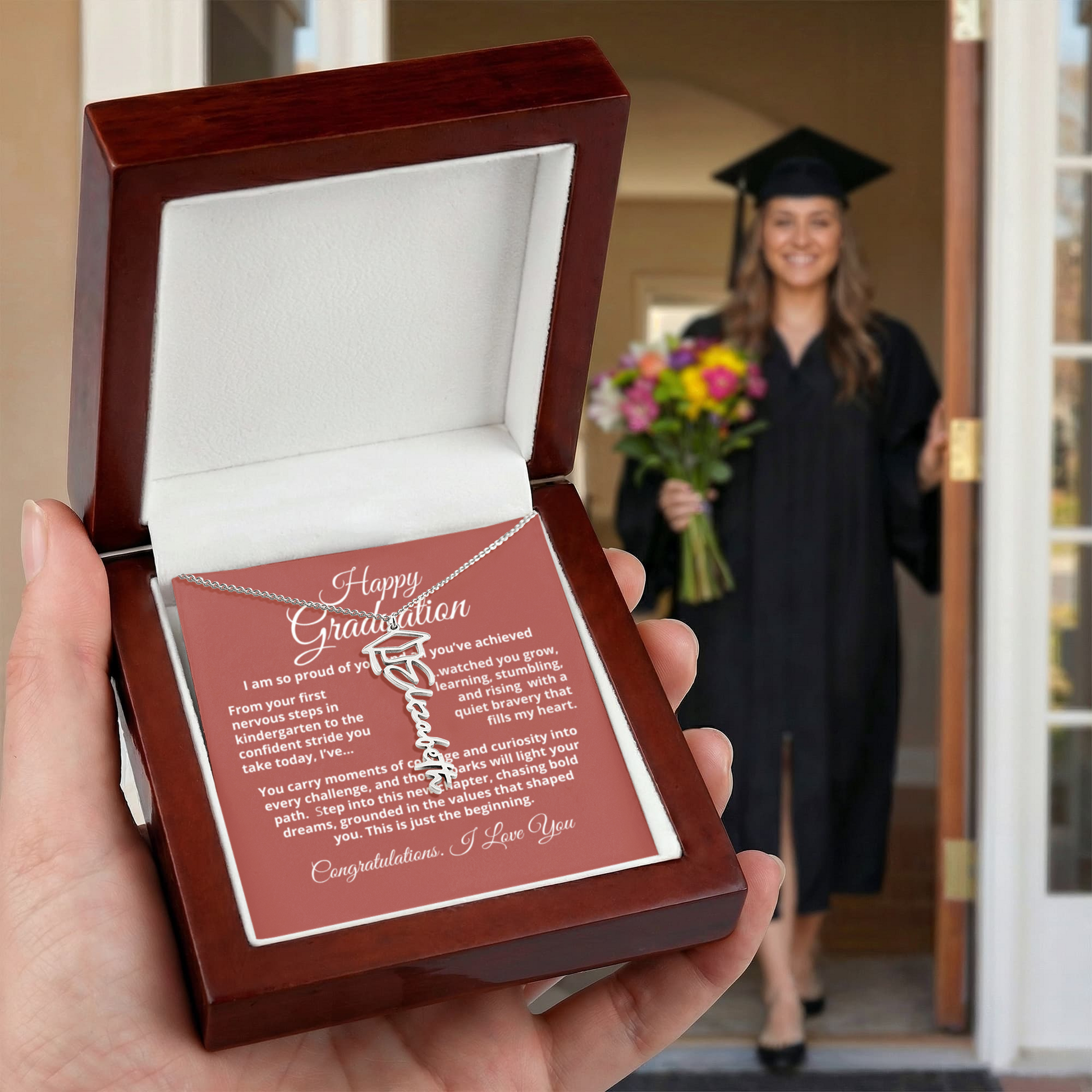 Graduate wearing the Graduation Cap Name Necklace — signature script nameplate with cap accent, perfect for commencement and everyday wear.