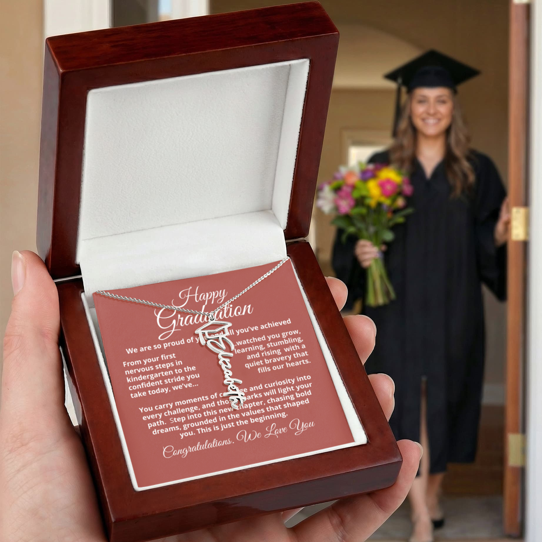 Graduate wearing the Graduation Cap Name Necklace — signature script nameplate with cap accent, perfect for commencement and everyday wear.
