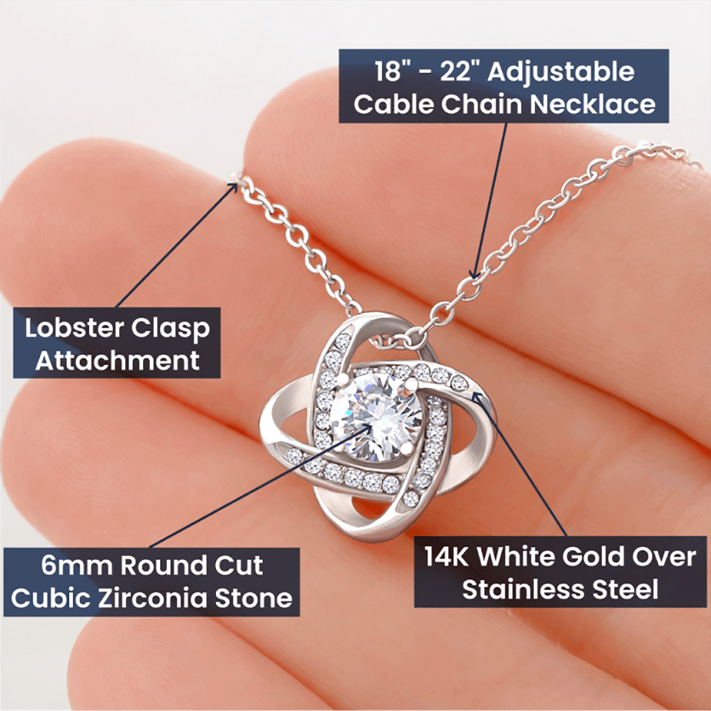 Necklace with lobster clasp attachment and 6mm round cut cubic zirconia stone held in hand.