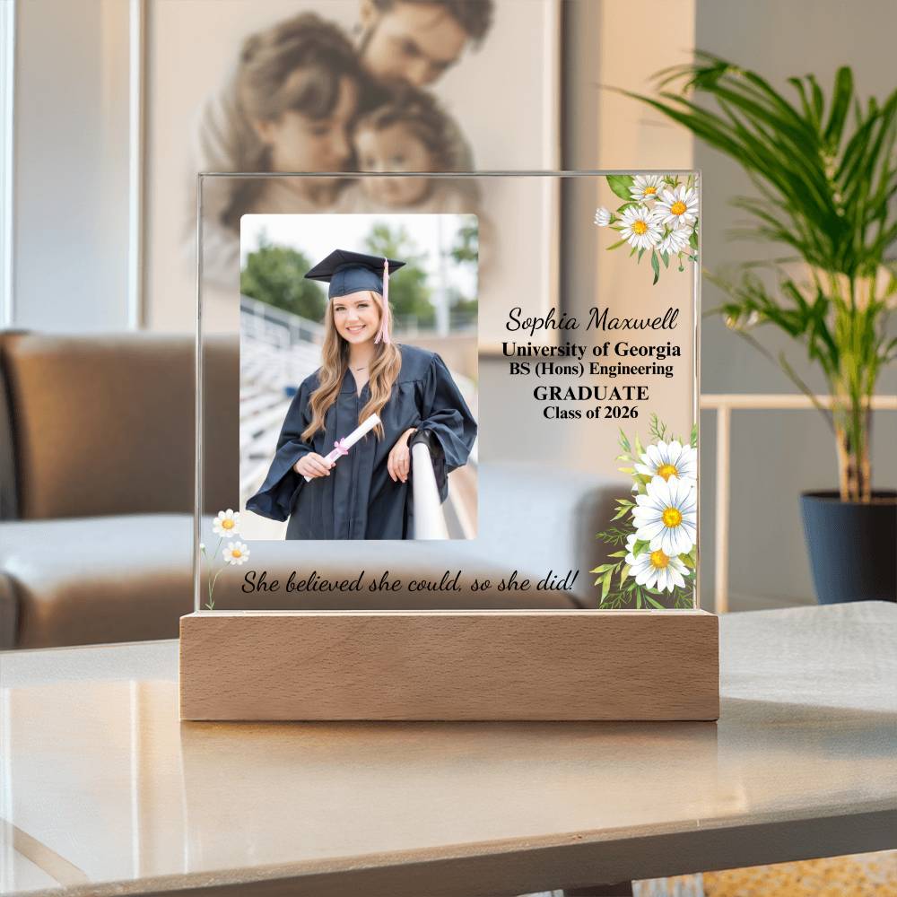 Graduation-themed decorative piece with a photo of a graduate and personalized text on a glass panel.
